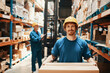 © Davor - Portrait young man in helmet holding box standing in warehouse looking at camera