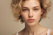© Boadicea - Portrait of young beautiful woman on beige background. Natural beauty.
