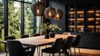 A black dining room with a wooden dining table, upholstered chairs, and pendant lighting
