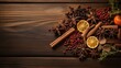 mulled wine spices arranged on a vintage wooden backdrop from a top perspective, with sufficient space for text or invitations.