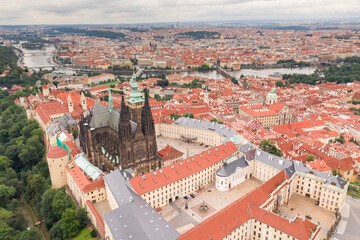 Canvas Print - Prague Old Town with St. Vitus Cathedral and Prague castle complex with buildings revealing architecture from Roman style to Gothic 20th century. Prague, capital city of the Czech Republic. Drone