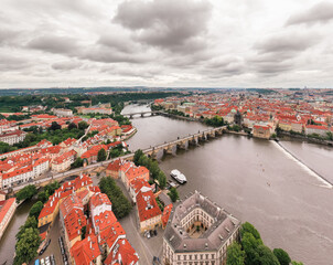 Poster - Prague Old Town in Czech Republic with Famous Sightseeing Places in Background. Charles Bridge Iconic 14th century Structure with View, Vltava river and Prague Cityscape. Must Visit City. Drone