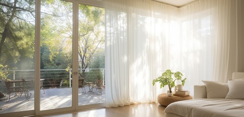Design a room that embraces natural light with large windows and sheer curtains. Photograph it during daylight to capture the sunlight streaming in.
