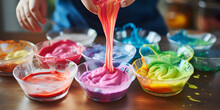 Image Of Rainbow Coloured Butter Icing For Cake Decorating In Dishes Like Paint, Pink, Red, Orange, Yellow, Green, Blue, Purple .Rainbow Hues In Cake Decorating Frosting .