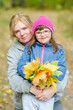 © Ermolaev Alexandr - Portrait of a Mother hugging her daughter with special needs  at autumn park