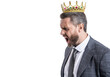 Angry businessman in suit and crown shouting in office at someone isolated on white, copy space