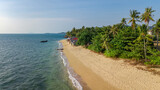 Fototapeta Morze - Aerial drone view of tropical beach from above, sea, sand and palm trees island beach landscape, Lanta, Thailand
