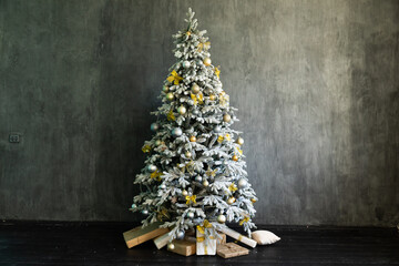 Wall Mural - Snowy christmas tree with gifts for new year in dark room interior