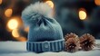 in blue knitted hat and scarf on the background of a Christmas tree
