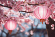 Chinese pink lanterns flaunt on the branches of sakura. Their delicate domes create a holiday under a flowering tree and inspire with the beauty of traditions and spring magic.