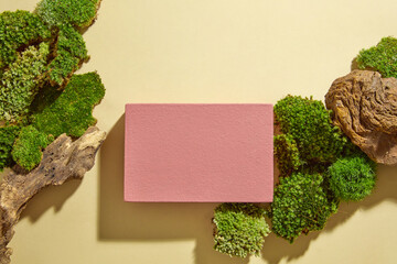 Sticker - Minimal empty display product presentation scene with rectangular red podium decorated on beige background with green moss and stone. Top view, concept for advertising cosmetic of natural ingredient