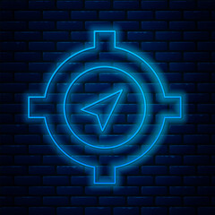 Sticker - Glowing neon line Compass icon isolated on brick wall background. Windrose navigation symbol. Wind rose sign. Vector