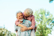 © Lumos sp - woman man outdoor senior couple happy lifestyle retirement together smiling love fun elderly active vitality nature mature portrait piggyback game