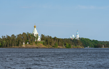 Wall Mural - The monastery rises above the pine trees of Valaam Island in Lake Ladoga