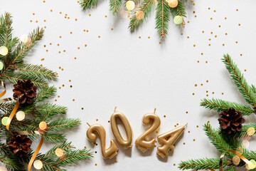 Wall Mural - christmas card banner with christmas tree branches and gold candle numbers 2024, golden decorative r