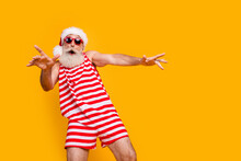 Photo Of Good Mood Carefree Elderly Guy Wear New Year Swimsuit Hat Sunglass Having Disco Fun Empty Space Isolated Yellow Color Background
