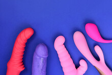 Vibrator sex toys for women on a blue background top view stock photo images. Set of erotic vaginal toys images. Dildo and vibrators on a blue background with copy space