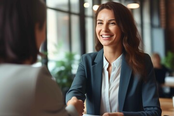 Mid aged business woman manager handshaking at office meeting. lawyer client at work