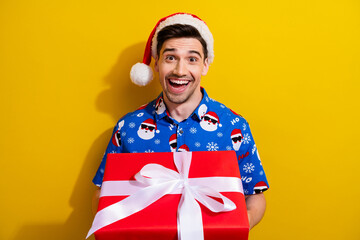 Poster - Photo of overjoyed person young man wear festival merry christmas party outfit demonstrate red surprise isolated on yellow color background