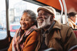 © Maria - Happy senior couple wearing warm clothes sitting in tram.