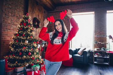 Sticker - Photo of overjoyed positive cool girl preparing new year party decorating room dancing dressed newyear costume indoors