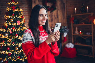 Wall Mural - Photo of adorable girl dressed red jumper reading instagram telegram post enjoying magic season indoors