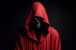 Man in a red robe with a hood a scary on solid black background. ai generative