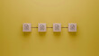© Gabriele - Sequential workflow with wooden blocks on yellow background, document transfer process,  organization and file management concept