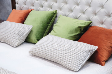 Poster - Interior of a modern bedroom in an apartment, hotel or private house with a bed and pillows