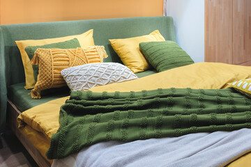 Poster - Interior of a modern bedroom in an apartment, hotel or private house with a bed and pillows