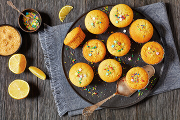 Sticker - sweet lemon muffins on black plate, top view