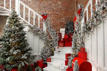 Wall Mural - Christmas tree, gift boxes and festive decor indoors. Interior design