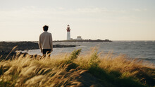 Lighthouse and man. Man walks near the lighthouse and enjoy beautiful nature landscape. Lonely male. Scenic northern outdoors view. Travel and adventure. Explore North. Generated AI