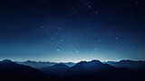 Fototapeta Na sufit -  a view of the night sky with stars above a mountain range in the foreground and the moon in the distance.