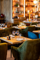 A table in a cafe for two with plates and wine glasses