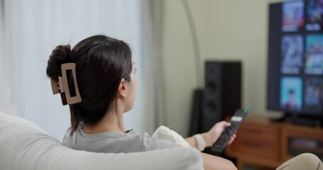 Poster - Woman watch video on television at home