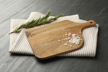 Sticker - Wooden cutting board, kitchen towel, rosemary and salt on dark grey table