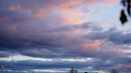 Wall Mural - the beautiful sunset view with the colorful clouds and warm sunlight