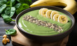 A nutritious spinach smoothie bowl spirulina topped with banana and seeds.