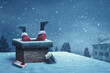 Leinwandbild Motiv Funny Santa Claus stuck with feet up in a chimney