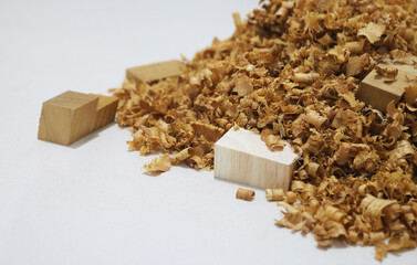 Closeup wood sawdust white background.