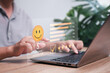 © NongAsimo - Customer satisfaction survey concept, A man gives five-star rating for a satisfaction survey and checks mark on the happy smiley icon, Online application Satisfaction Review best quality of product