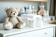Baby care essentials: lotion powder diapers on nursery changing table 
