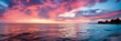 Sunset paints Lake Michigan's horizon with vibrant fading evening hues 