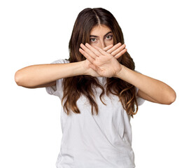 Young Caucasian woman in studio setting doing a denial gesture