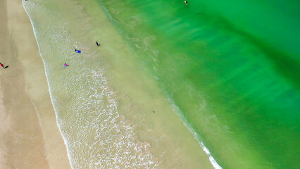 Aerial view of Surfers finding waves in Lombok, Indonesia