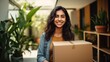 © Hixel - Happy smiling hispanic woman carrying cardboard box with belongings. Female student moving out of parents house. Young woman moving to dorm, new apartment, rent a flat generative ai