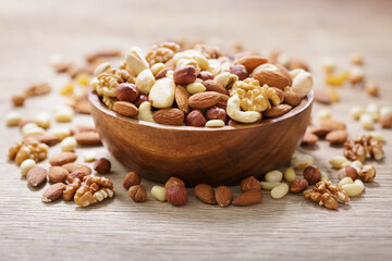 Sticker - bowl of mixed nuts on wooden table