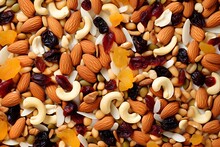 A Mixture Of Nuts, Muesli, Nutritious Food. Background With The Texture Of A Mixture Of Nuts.