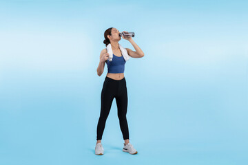 Athletic and sporty asian woman resting and drink water after intensive cardio workout training. Healthy exercising and fit body care lifestyle pursuit in studio shot isolated background. Vigorous